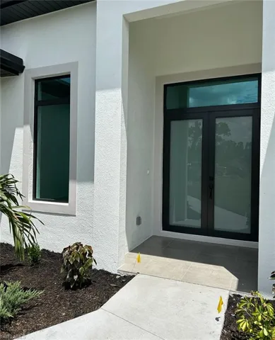 Doorway to property with french doors