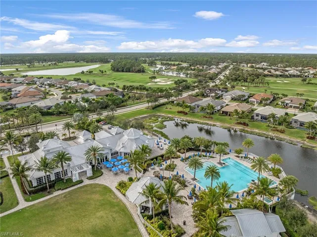 Drone / aerial view of a golf club and a large body of water
