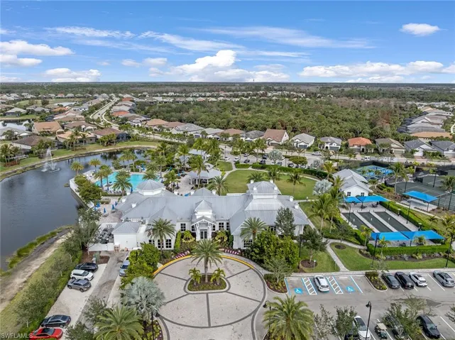 Aerial view of residential area featuring a nearby body of water