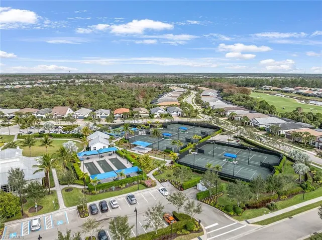 Aerial view of residential area featuring a golf club
