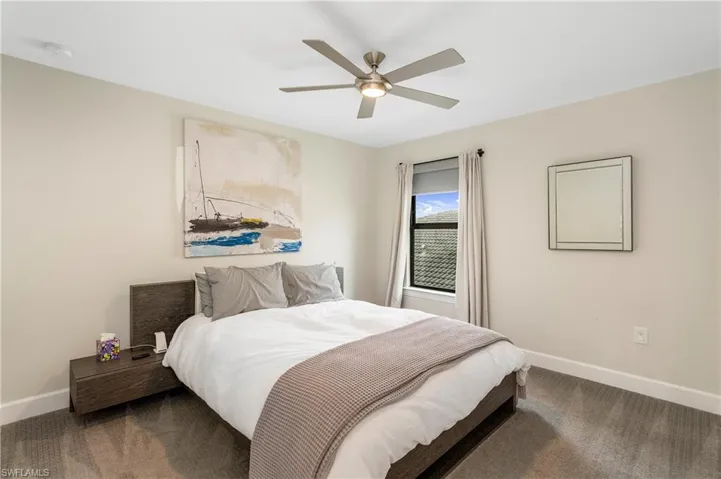 Bedroom featuring carpet flooring and a ceiling fan
