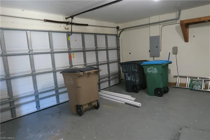 Garage featuring electric panel