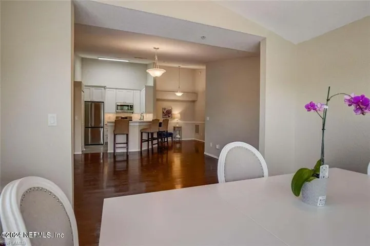 Dining room featuring dark wood-type flooring