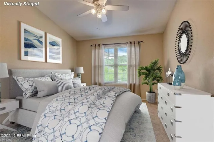 Carpeted bedroom with ceiling fan