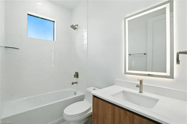Full bathroom with vanity and tub / shower combination