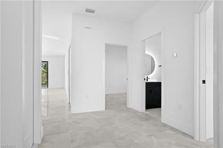 Corridor featuring baseboards