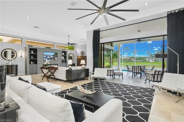 Great room with built-in featuring linear fireplace