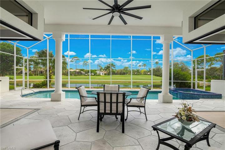 South exposure lanai/pool/spa with expansive lake/golf views