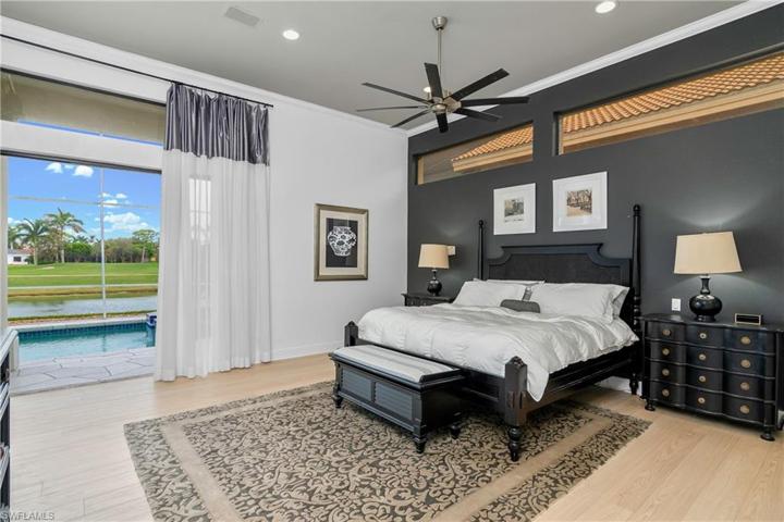 Large owners suite with pocket doors to lanai/pool/spa