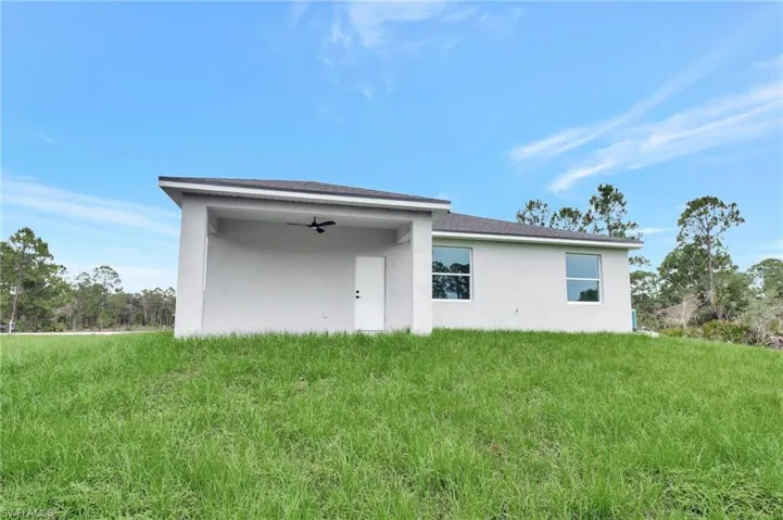 View of front of house with stucco siding