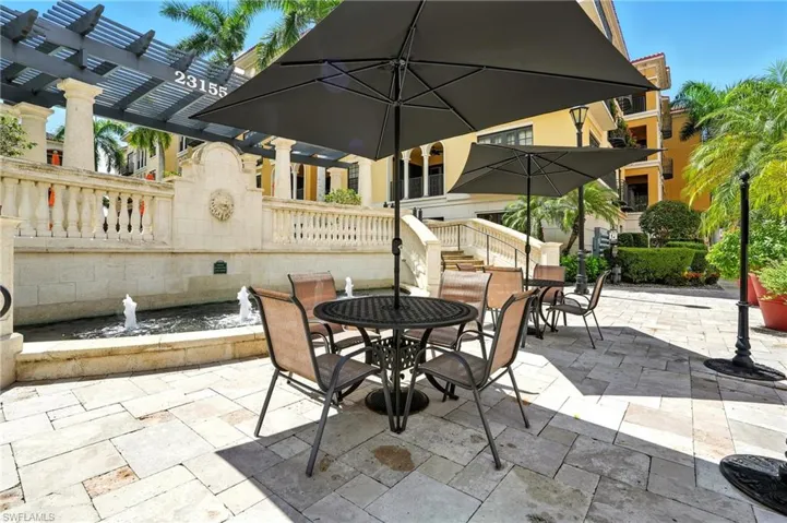 Seating area outside of pool and fountains