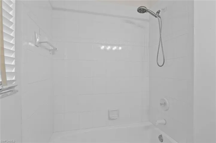 Bathroom featuring shower / washtub combination