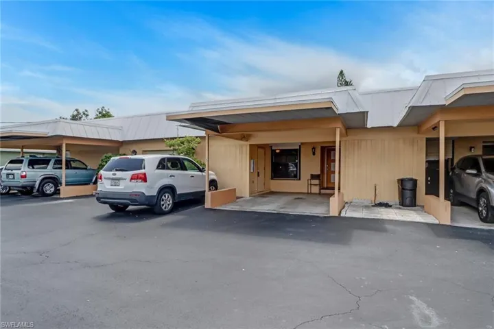 View of front of house featuring a carport