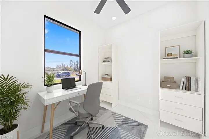 Office space with ceiling fan, light marble finish floors, and recessed lighting