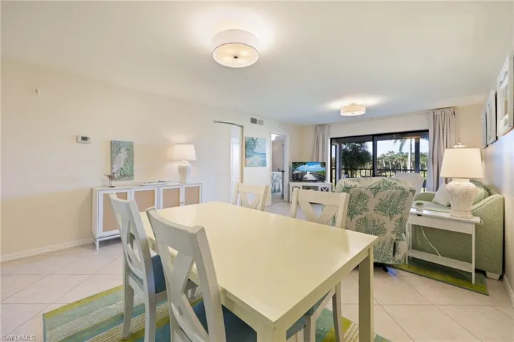 Dining area featuring new light fixtures.