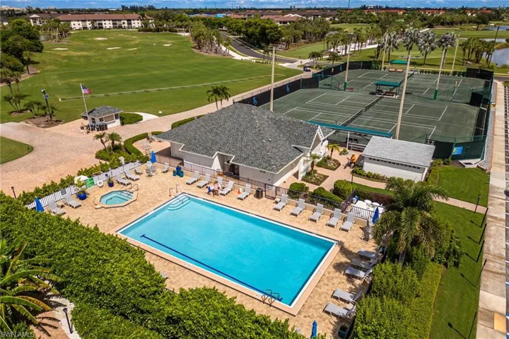 Kelly Greens Community pool area next to clubhouse with a snack area with canopy coverage to enjoy all year around. Grab a snack and watch the golfs practice their swing!