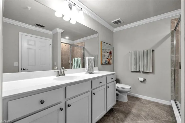 Dual sinks with shower and walk in closet