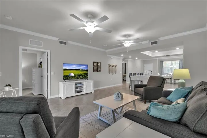 Lanai to the left, owner's suite entry then kitchen and dining to the right