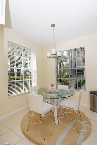 Enjoy a light meal or get caught up on your email at the glass dining table that is flanked by two oversized windows.