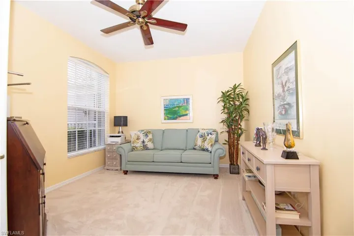 Den with french doors offers flexibility and can function as a home office or an additional space for guests.