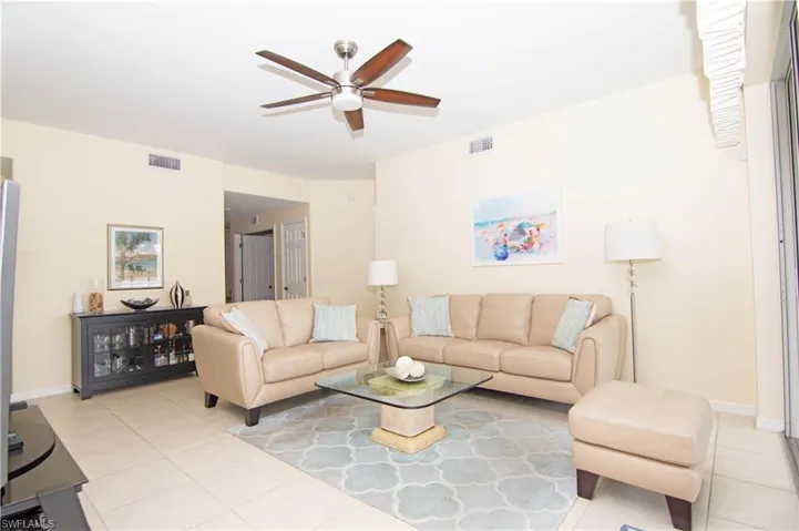Spacious living room allows for terrific furniture placement options and includes the cool coastal furnishings.