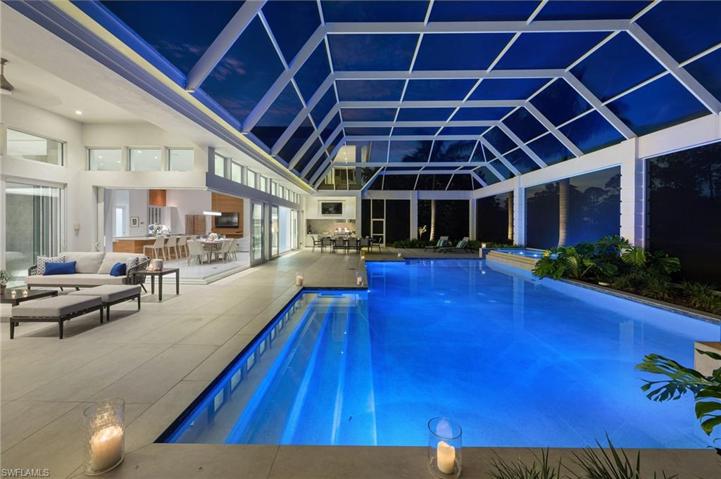 The pool and lanai area of this home captivates what the Naples lifestyle is all about.