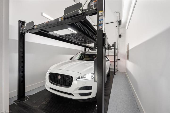 This home as four garage bays, one equipped with a lift.
