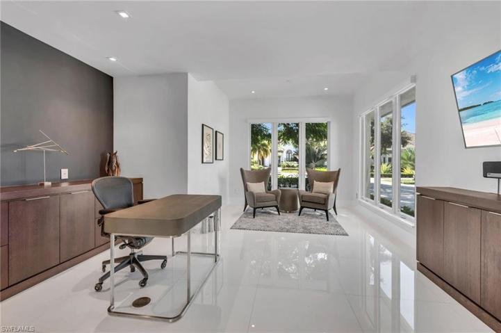 French doors close off the expansive yet inviting office with rich custom cabinetry.  There is always plenty of sunshine in here!