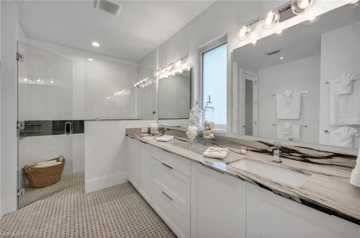 The two guest suites have a huge bathroom with double vanity, two, large, walk-in closets, and plenty of space.