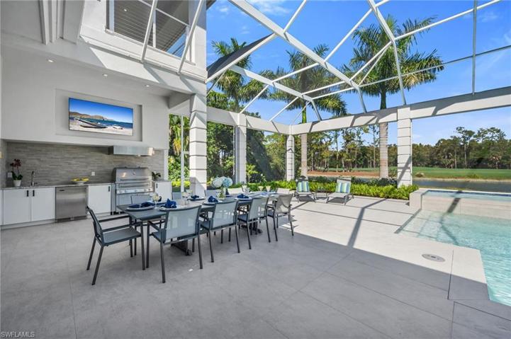 The outdoor space in this home is hard to beat, with full outdoor kitchen, plenty of entertaining space, TV for all your favorite game-watching, and private views...