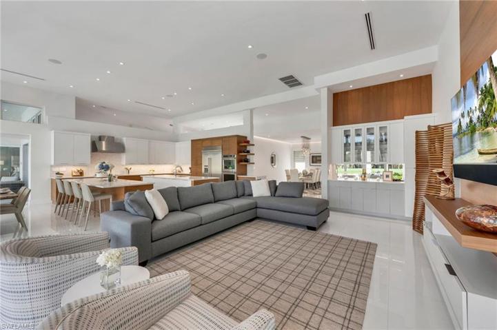 he custom, built-in bar is in the perfect location between the kitchen and dining room.