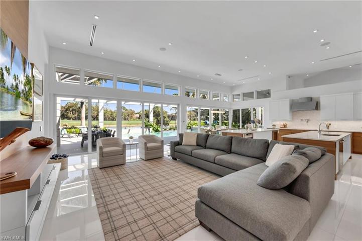 Everyone's favorite room is always the kitchen and family room, and what inviting views this great room has to the pool and lake and golf course!