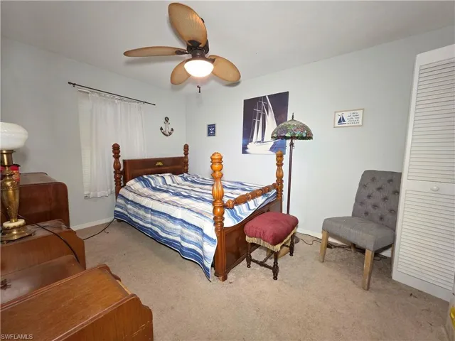 Bedroom with carpet and a ceiling fan