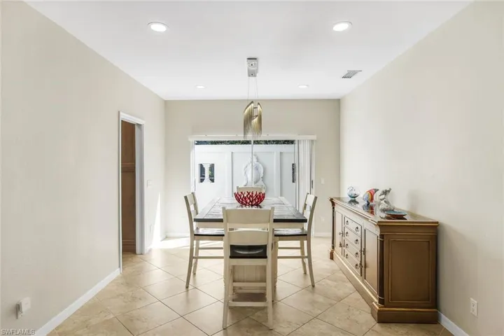 Inviting dining area featuring recessed lighting and an open layout ideal for entertaining.
