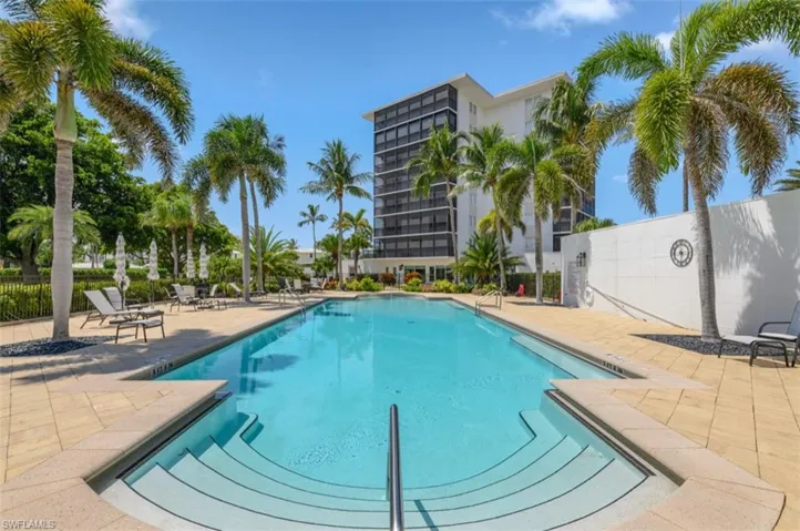 Community pool featuring a patio