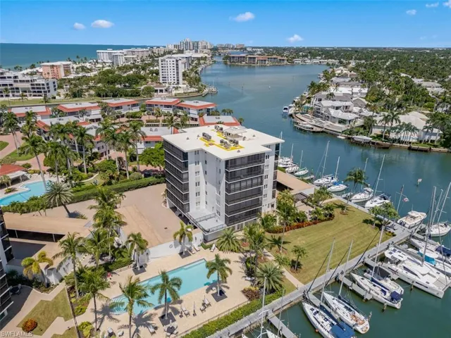 View of urban area with a large body of water and numerous boat docks