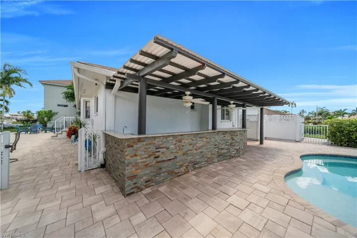 View of patio featuring a ceiling fan