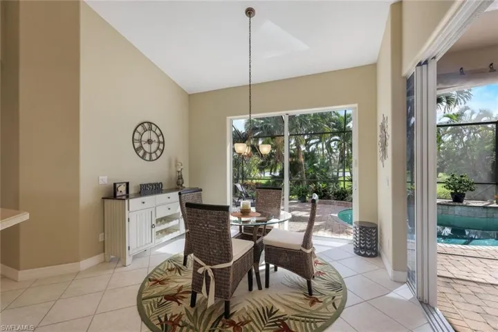Dining area in kitchen can be opened to the spacious lanai and pool area - great for entertaining