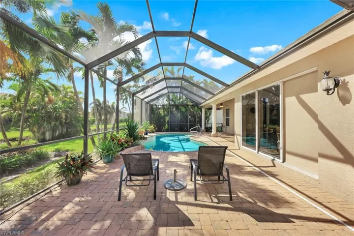 Spacious, screened lanai/pool area with pocket slider to the kitchen dining area