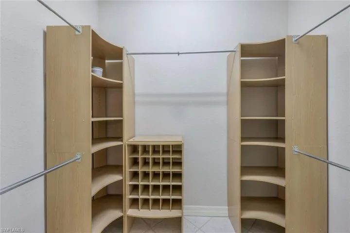 Custom built walk-in closet in primary bedroom