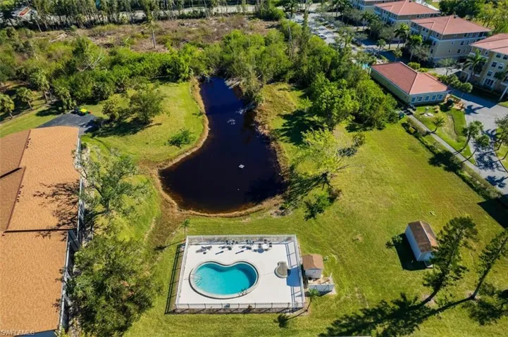Aerial view of a nearby body of water and a pool