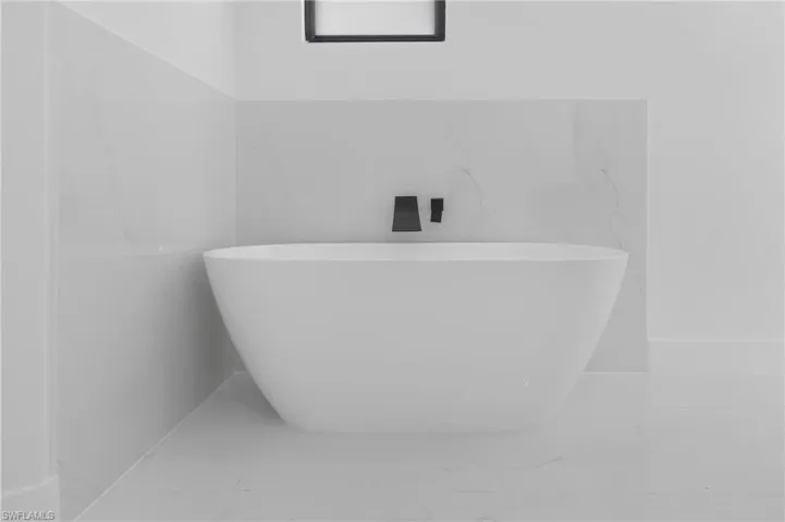 Bathroom featuring tile walls and tile patterned floors