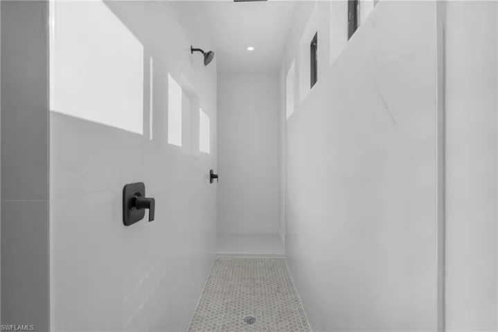 Bathroom featuring tiled shower