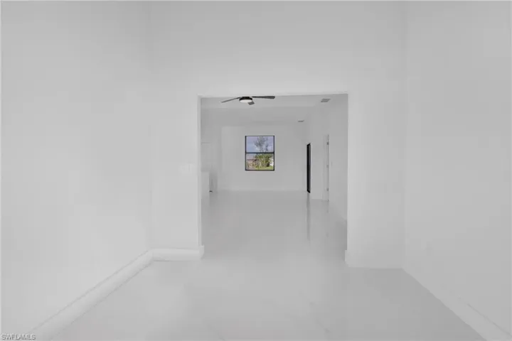 Hallway with tile patterned flooring