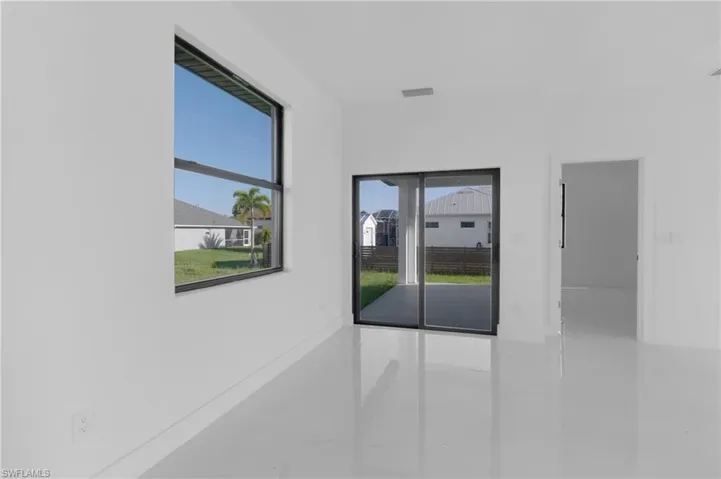Spare room with tile patterned flooring