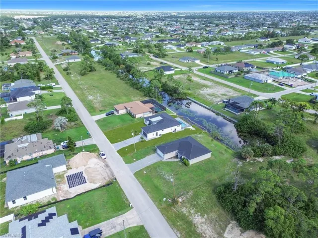 View of property location with nearby suburban area