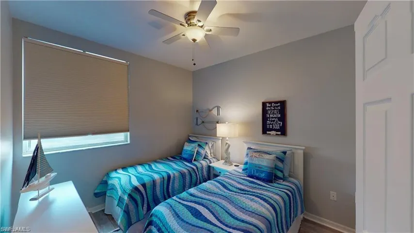 Bedroom featuring ceiling fan and wood finished floors