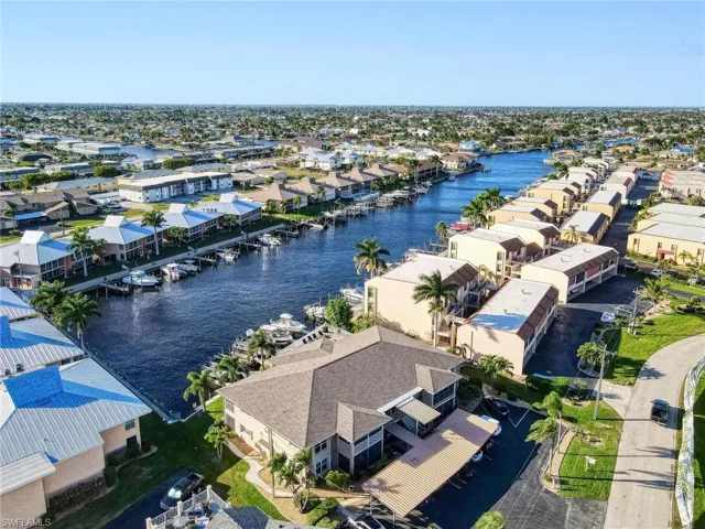 Aerial perspective of suburban area with a nearby body of water