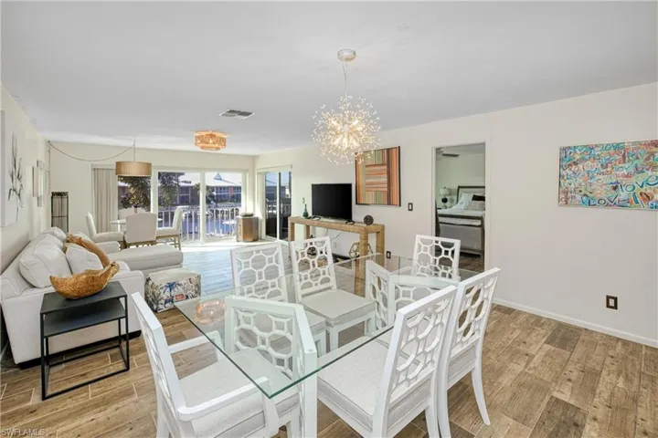 Dining room with a chandelier and light wood-style flooring
