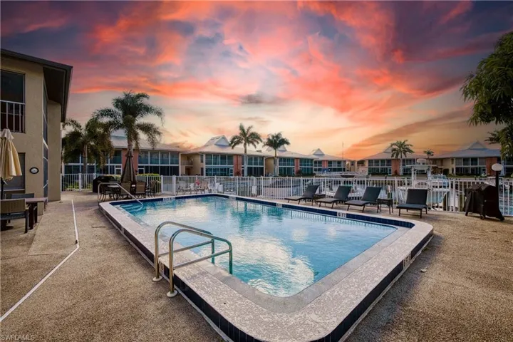 Community pool with a patio area